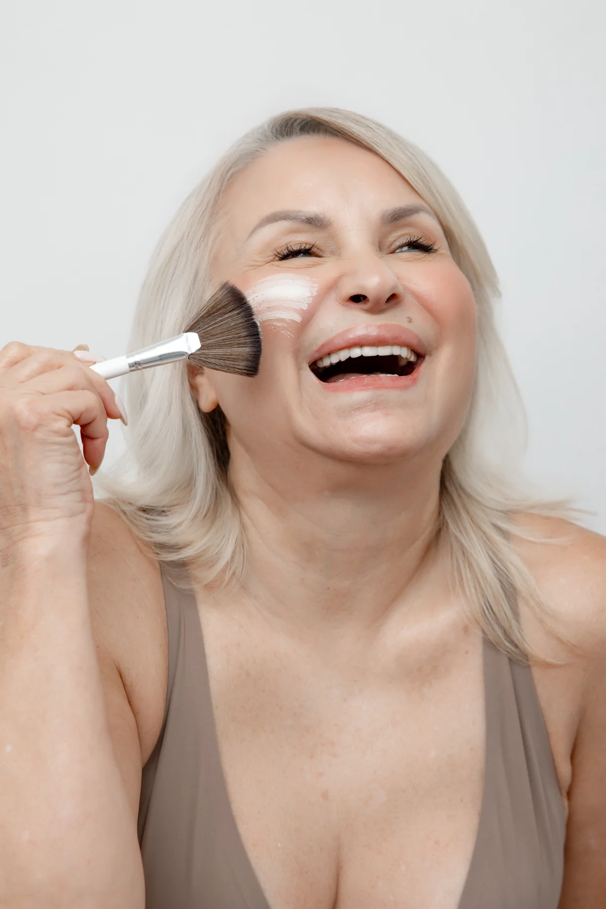 A mature guest enjoying a facial mask