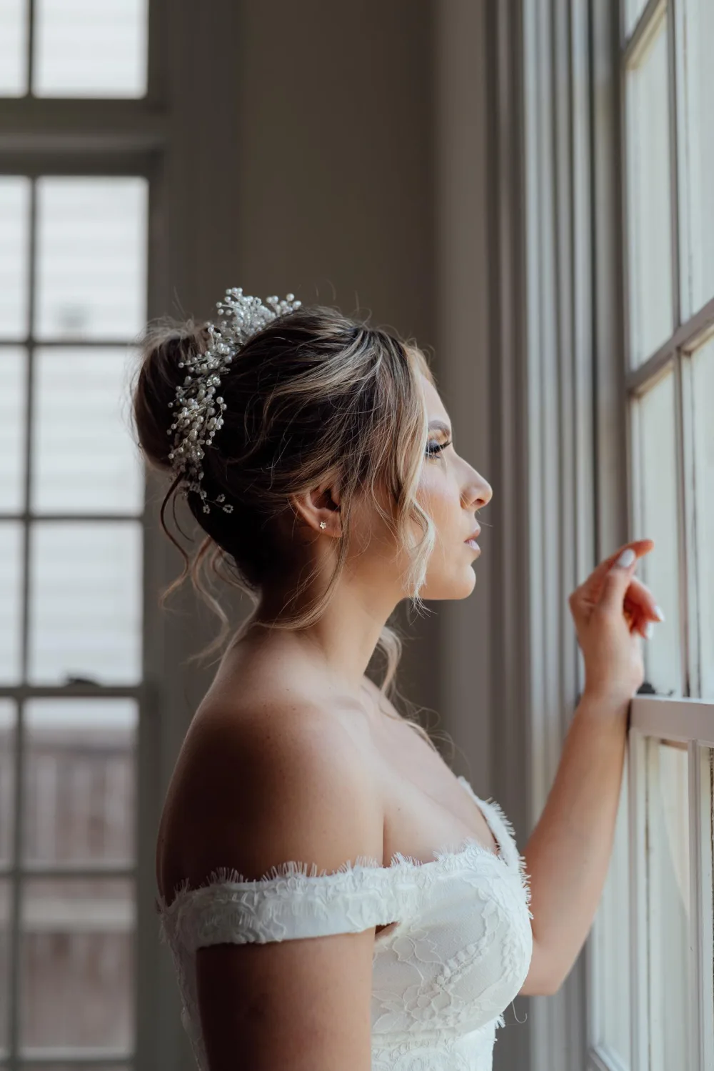 Side view of bridal makeup and a textured updo