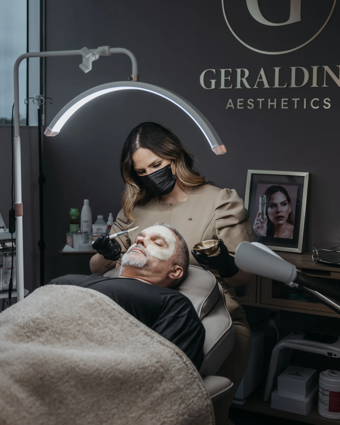 Geraldine applying a facial treatment during a spa session